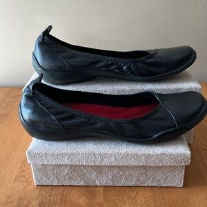 Women's size 8.5 black leather slip-on flats. Flexible sole.